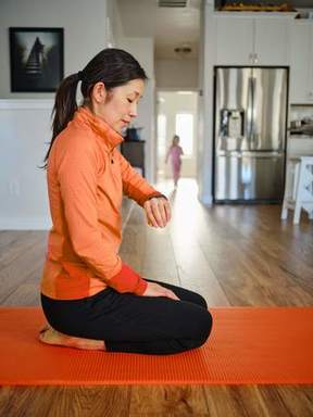 PHOTO Exercise woman sitting on exercise matt.jpg